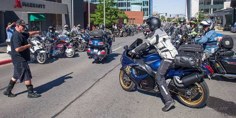 A group of motorcycles parked on the side of a street

Description automatically generated with medium confidence